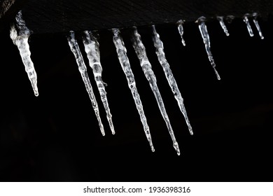 Icicles hanging in a row
