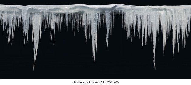 Icicles on an black background, isolated object.