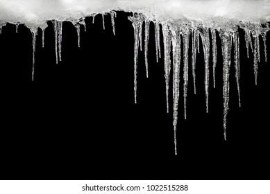 Icicles on a black background, place for text, template for design, set