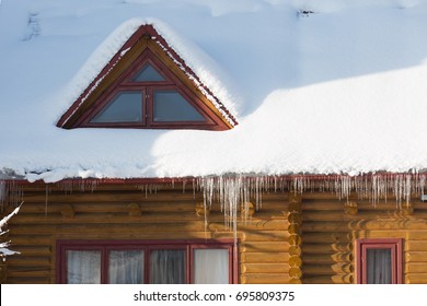 Icicles On The Snow-covered Roof, Winter Photo