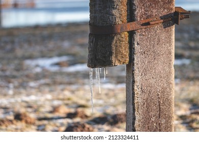 icicles on wooden electric pylon