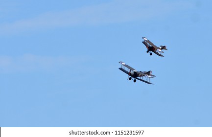 ICKWELL, BEDFORDSHIRE, ENGLAND - AUGUST 05, 2018: Vintage  Bristol F2.B  And Sopwith Camel WW1 Aircraft In Flight.