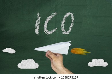 ICO - The Initial Concept Of Coin Placement For The Funding Startup Projects. Paper Airplane And ICO Text On Chalkboard