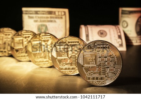 ICO for startup funding - concept. Initial Coin Offering is an alternative to an IPO for launching a cash flow. In the picture there are coins of electronic currency and cash dollars.