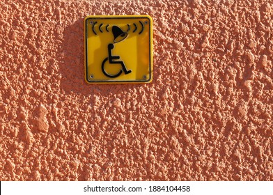 Icon Of Disabled Man On Wheelchair And Ring Bell Sign On The Wall. Disabled People Help With Copy Space For Text