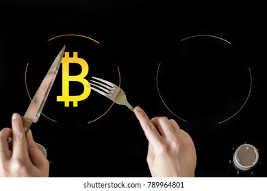 A Icon Of Virtual Electronic Gold Money Bitcoin On The Electric Plate Hob. The Concept Of Finance And Food. The Concept Of High Quality Food In A Elite Restaurant. Business Lunch Concept