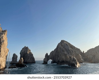  Iconic Arch of Cabo San Lucas in Mexico, a natural rock formation rising from the sea under a clear blue sky. A famous attraction surrounded by scenic ocean views. - Powered by Shutterstock