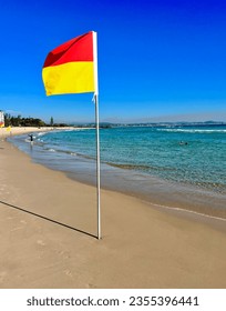 Iconic Australian surf lifesaving flag on the beach at Coolangatta QLD Australia.