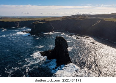 The iconic "Candlelight" sea stack at Kilkee, dramatically set against the rugged cliffs. County Clare - Powered by Shutterstock