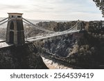 The iconic Clifton Suspension Bridge in Bristol, England. This majestic suspension bridge spans the Avon Gorge, offering breathtaking views of the surrounding countryside.