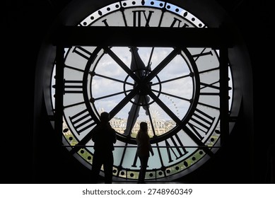 The iconic clock face inside the Musée d'Orsay in Paris, showcasing the beautiful art deco architecture and historic railway station building