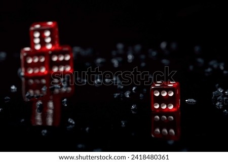 Iconic dice roll. dice games. A game in reality. Number six. Black background and red dice. 