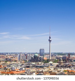 Iconic Fernsehturm television tower overlooking Berlin cityscape from a dizzying 1200 ft in the Alexanderplatz district.