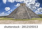 Iconic front view of the Temple of Kukulkan El Castillo at the UNESCO World Heritage site of Chichen Itza.