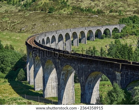 iconic Glenfinnan viaduct of the jacobite steam train in the scottish highlands.