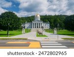 The iconic greek revival state house in the montpelier the capital of Vermont on a sunny day.