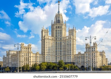 The iconic high-rise building on Kotelnicheskaya Embankment in Moscow, showcasing its classic Stalinist architecture against a bright, cloudy sky. - Powered by Shutterstock