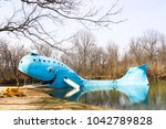 Iconic huge Blue Whale roadside attraction by swimming hole on Route 66 in Oklahoma on a winter day