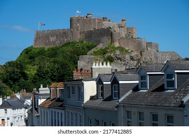 The Iconic Mont Orgueil Castle Guarding The Entrance To Gorey Harbour Of The British Crown Dependency Of Jersey, Channel Islands, British Isles.