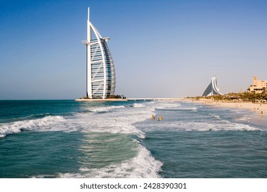 The iconic symbol of Dubai, the Burj Al Arab, the world's first seven star hotel (classified as five star deluxe), built on an artificial island offshore from the Jumeirah Beach Hotel, Dubai, UAE - Powered by Shutterstock