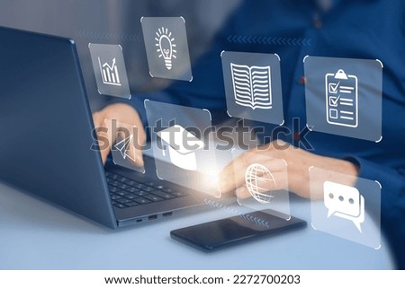 Icons of online education, planet, airplane and idea on background of laptop and hands of businessman. Man in blue shirt uses computer to study lessons on Internet, concept of e-learning, online cours