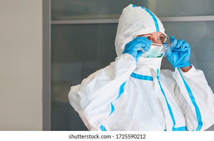 ICU Doctor Or Nurse In Protective Clothing During Coronavirus Epidemic In Hospital