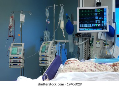 ICU Room In A Hospital With Medical Equipments And A Patient