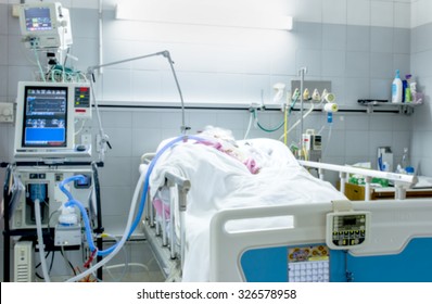 ICU Room In A Hospital With Medical Equipments And Patient
