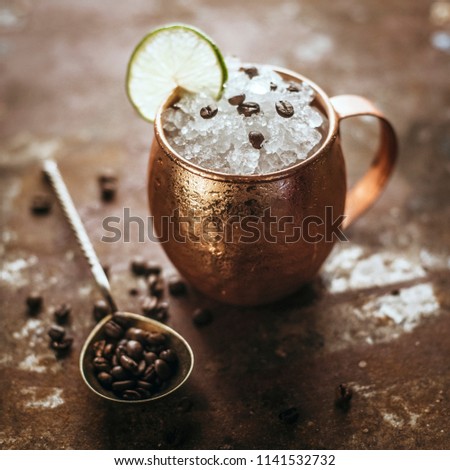 Icy Cold Moscow Mule cocktail with Ginger Beer, Vodka and coffee beans