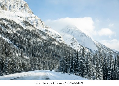 Icy Road With A Snowy Landscape In Canada