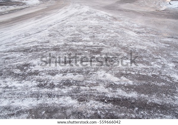 Icy road in a\
winter\'s day. Ice covered\
road