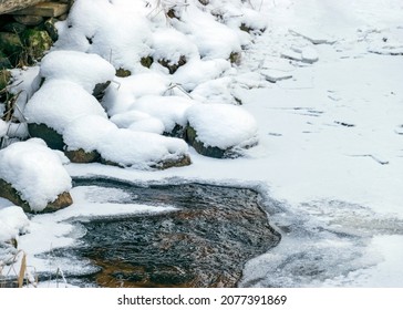 Icy And Snowy Rocks On The River Bank, Winter Background