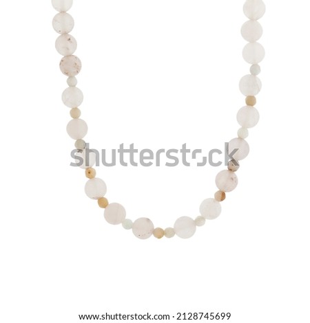 Icy stone beaded necklace. Isolated beaded necklace on a white background