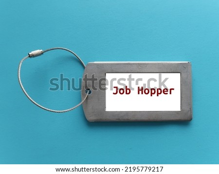 ID holder with title JOB HOPPER, means person who works briefly in one position after another rather than staying long  term in organization