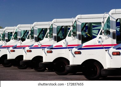 Idaho Falls, Idaho Jul. 14, 2010  A Row Of US Postal Service Trucks, Parked Waiting To Deliver The Mail.