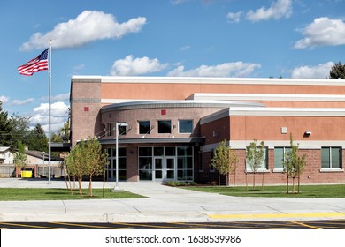 Idaho Falls, Idaho, USA August 8, 2014 The exterior of a new elementary school showing the entry/exit doors, and modern facade.
