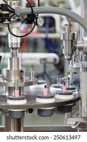 Idaho Falls, Idaho, USA June 18, 2012 A vial filling machine in a cosmetics factory.