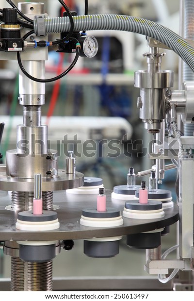 Idaho Falls, Idaho, USA  June 18, 2012\
A vial filling machine in a cosmetics\
factory.