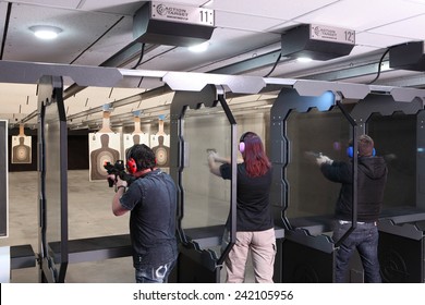 Idaho Falls, Idaho, USA Nov. 18, 2014,  Shooters practicing tactical shooting in a modern indoor gun range.