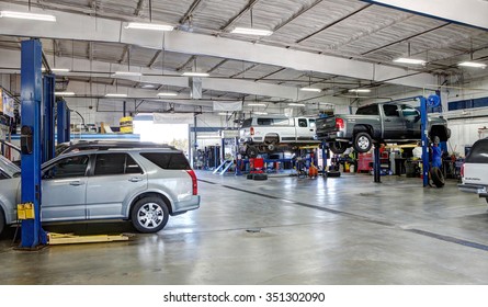 Idaho Falls, Idaho, USA Oct. 8, 2015 A Mechanic Working On A Car In A A Modern Automotive Repair Shop.