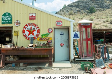 Idaho, USA - August 22, 2013: Outside of an old service station with an antique phone booth