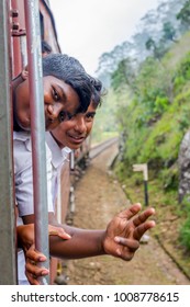 IDALGASHINNA, SRI LANKA - FEBRUARY 2: Two Local School Kids In Uniforms Hanging Out The Train. February 2017