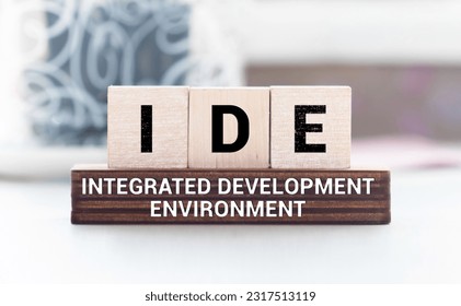 IDE - Integrated Development Environment - software application that provides comprehensive facilities to computer programmers for software development, acronym concept on notepad