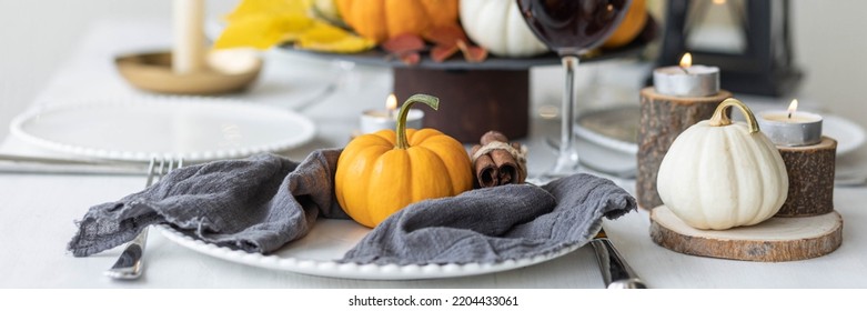 Idea For A Beautiful Autumn Setting For Thanksgiving Family Dinner Or Wedding. Orange Pumpkin As Decor. Cozy Fall Home Atmosphere. Banner Copy Space For Text