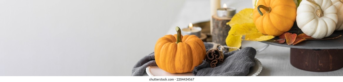 Idea For A Beautiful Autumn Setting For Thanksgiving Family Dinner Or Wedding. Orange Pumpkin As Decor. Cozy Fall Home Atmosphere. Banner Copy Space For Text