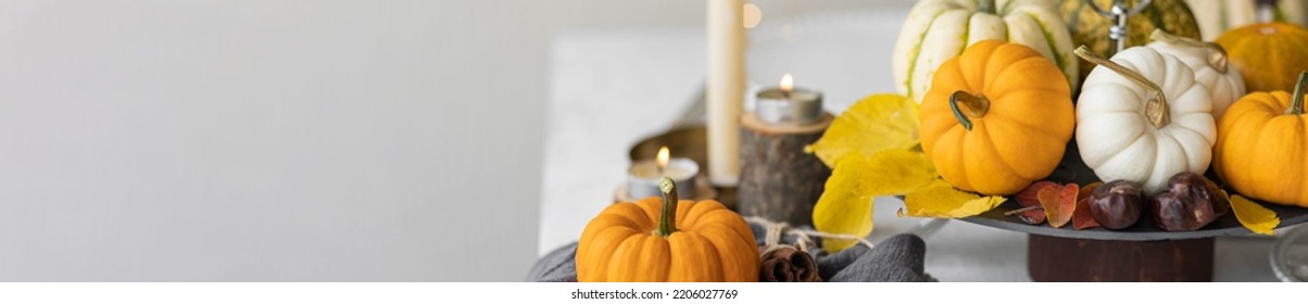 Idea For A Beautiful Autumn Setting For Thanksgiving Family Dinner Or Wedding. Orange Pumpkin As Decor. Cozy Fall Home Atmosphere. Banner Copy Space For Text