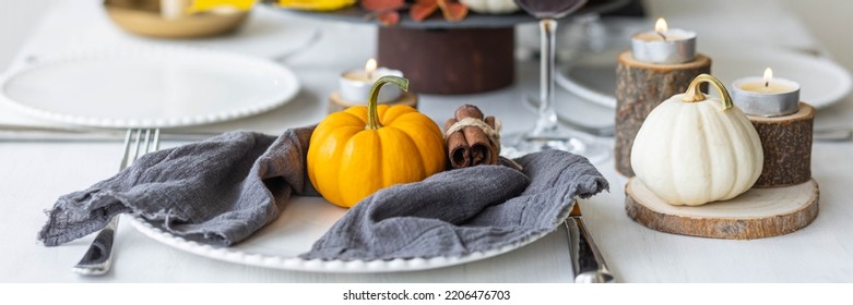 Idea For A Beautiful Autumn Setting For Thanksgiving Family Dinner Or Wedding. Orange Pumpkin As Decor. Cozy Fall Home Atmosphere. Banner Copy Space For Text