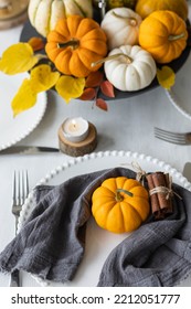 Idea For A Beautiful Autumn Setting For Thanksgiving Family Dinner Or Wedding. Orange Pumpkin As Decor. Cozy Fall Home Atmosphere.