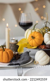 Idea For A Beautiful Autumn Setting For Thanksgiving Family Dinner Or Wedding. Orange Pumpkin As Decor. Cozy Fall Home Atmosphere.