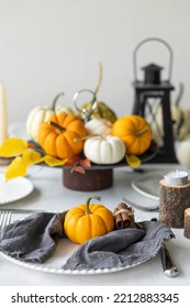 Idea For A Beautiful Autumn Setting For Thanksgiving Family Dinner Or Wedding. Orange Pumpkin As Decor. Cozy Fall Home Atmosphere.